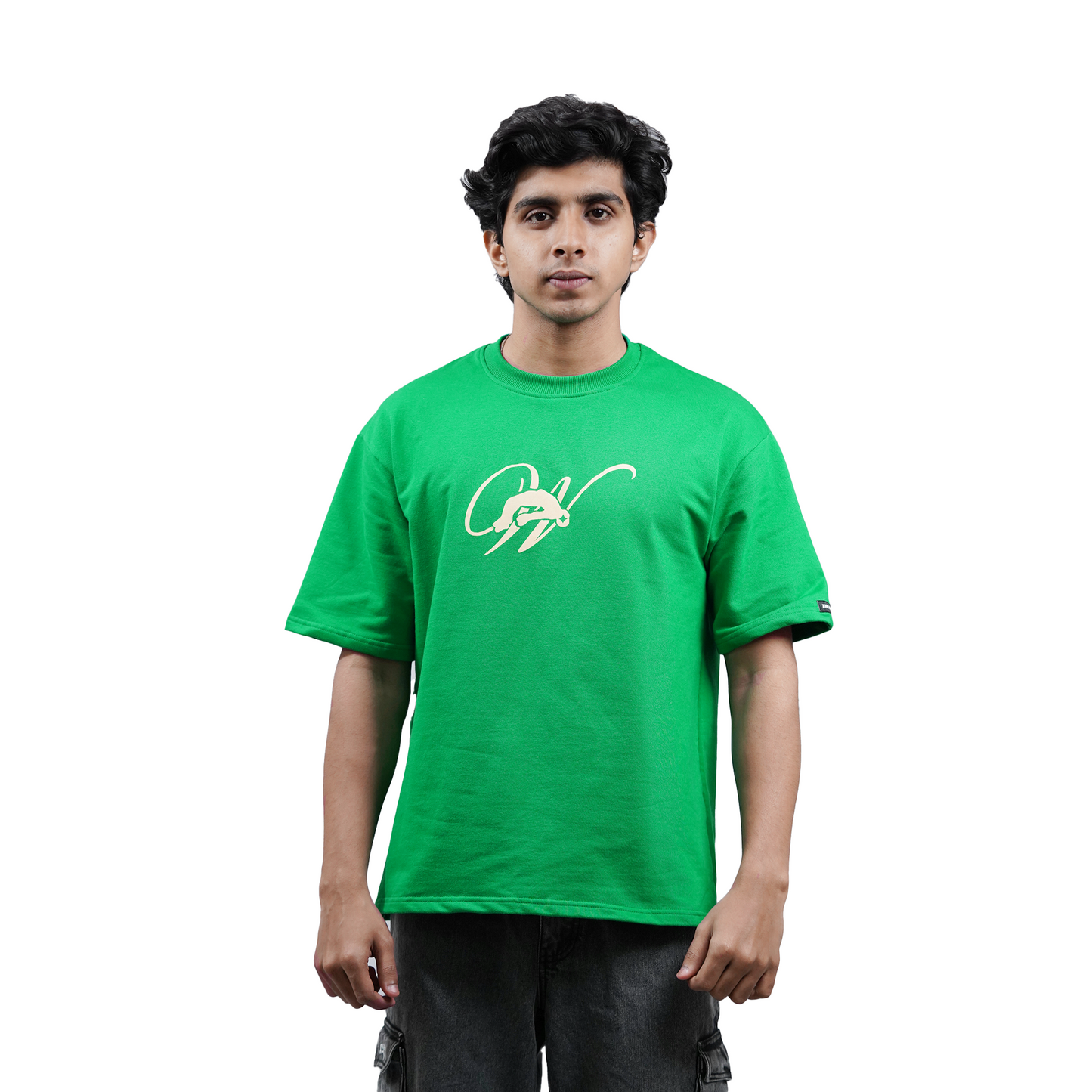 model wearing green oversized tshirt with white background and grey cargo facing front