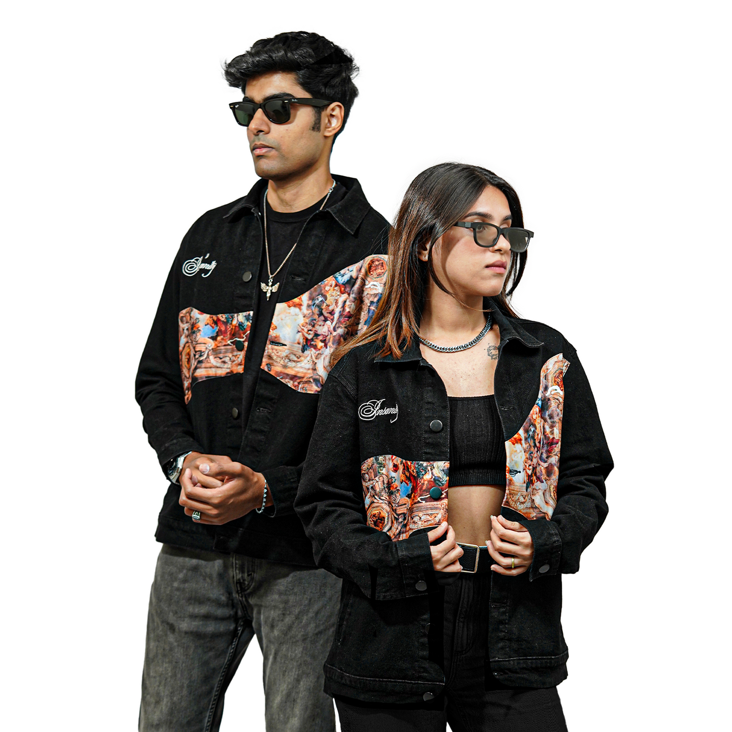 A male and female model wearing matching black denim jackets with embroidered text "Insanity" on the chest and a printed fabric design on the front panel. Both are wearing sunglasses and posing confidently against a plain white background.