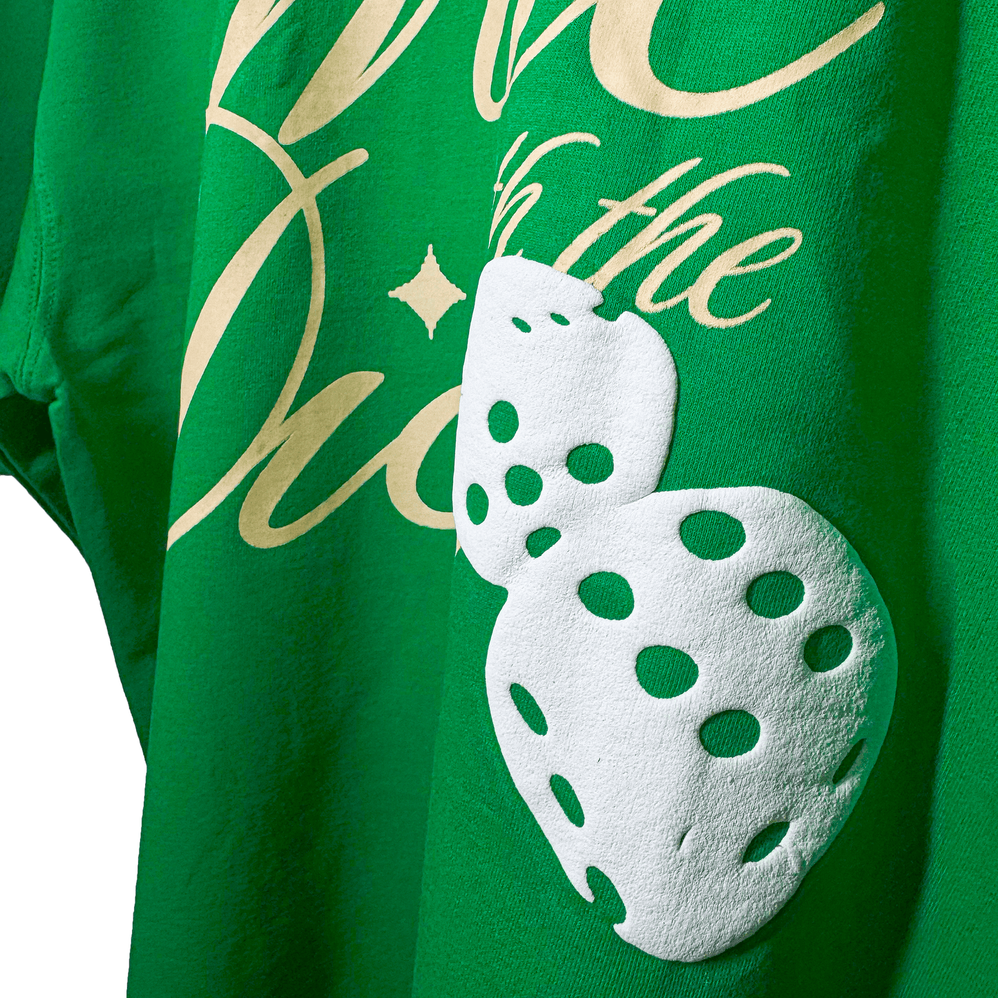 close up shot of green tshirt puffed dice design on back
