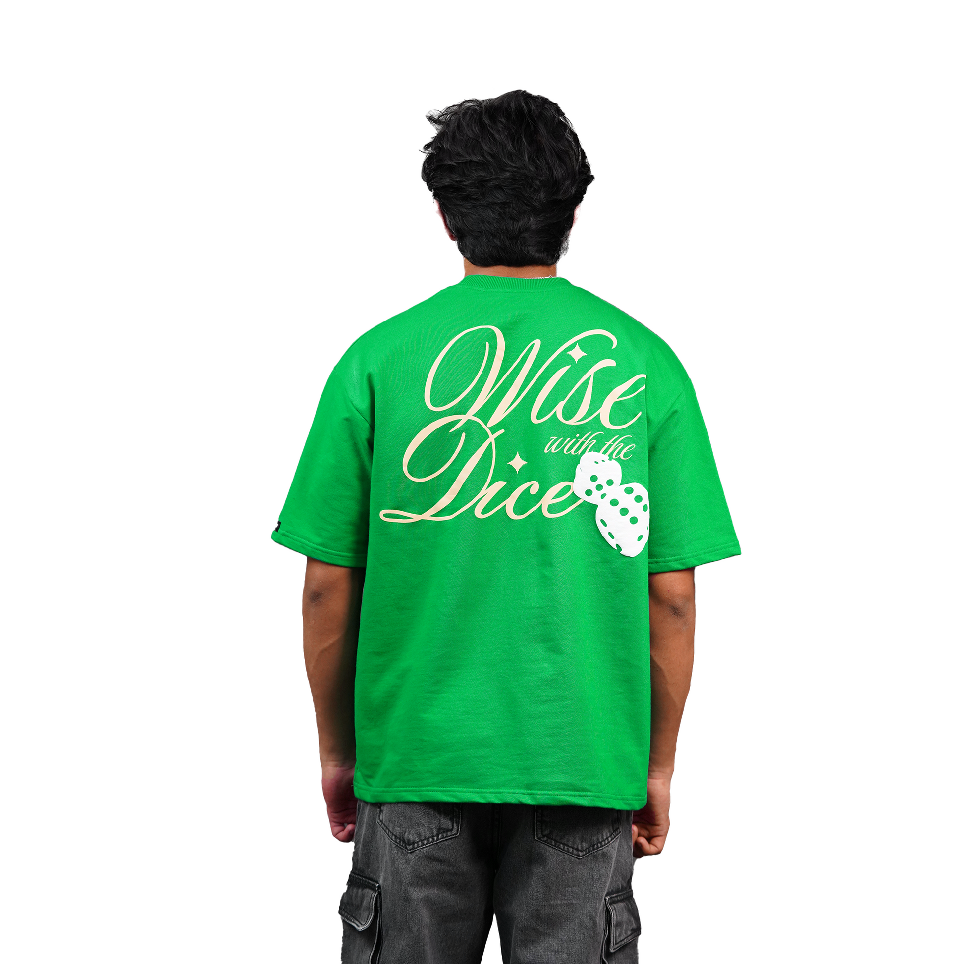 model wearing green oversized tshirt  with white background and grey cargo facing back