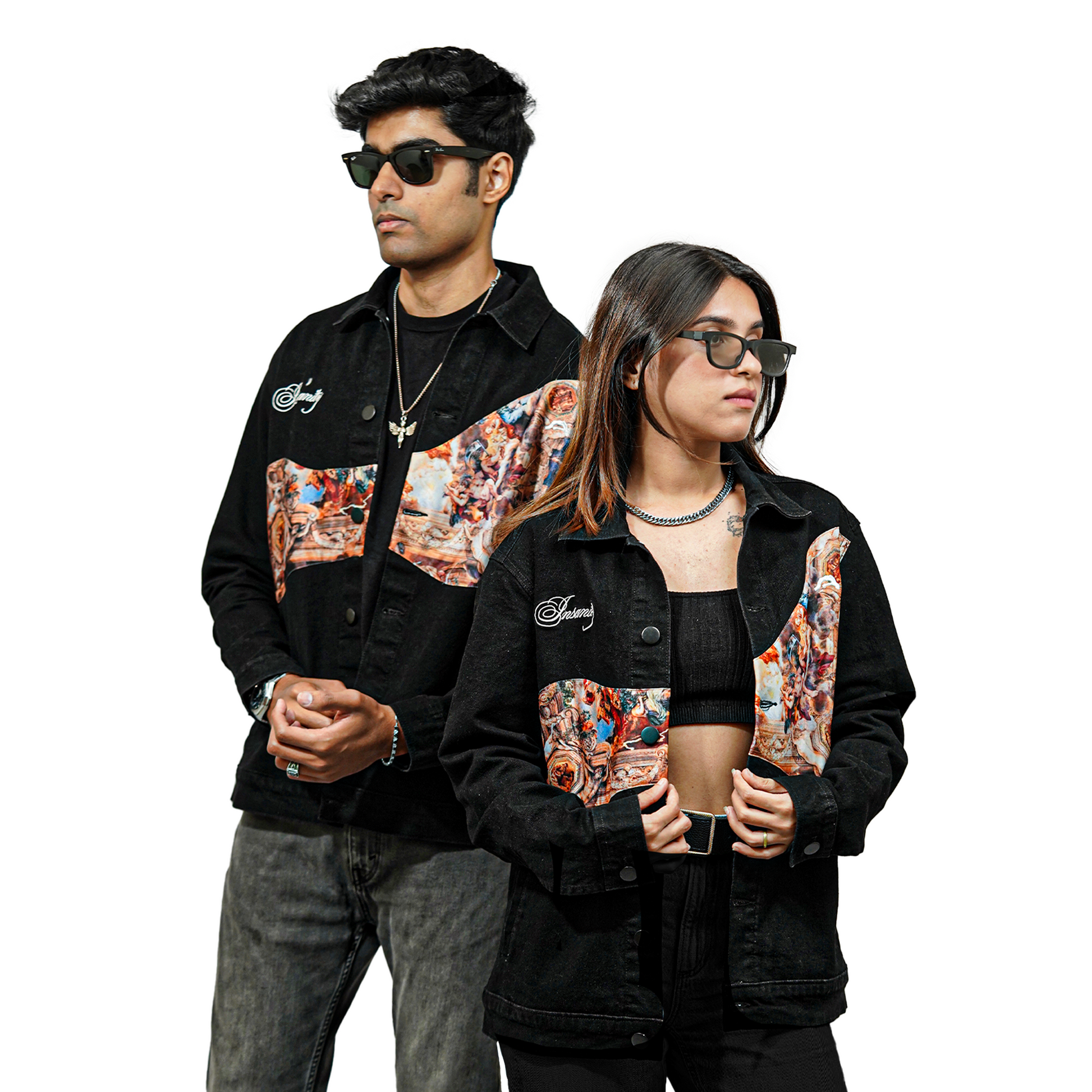 A male and female model wearing matching black denim jackets with embroidered text "Insanity" on the chest and a printed fabric design on the front panel. Both are wearing sunglasses and posing confidently against a plain white background.